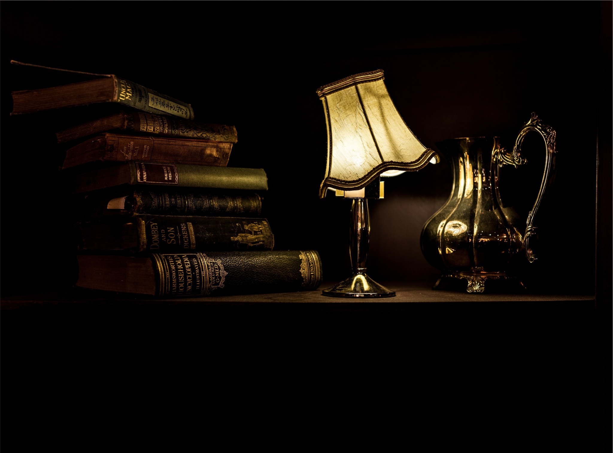 Books and a desk lamp as a learning atmosphere